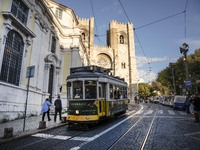 A tram moves through one of the streets of the Baixa district in Lisbon, Portugal, on October 27, 2024. (