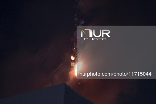 A telecommunication tower is on fire in downtown Tehran, Iran, on October 27, 2024. 