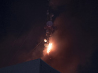 A telecommunication tower is on fire in downtown Tehran, Iran, on October 27, 2024. (