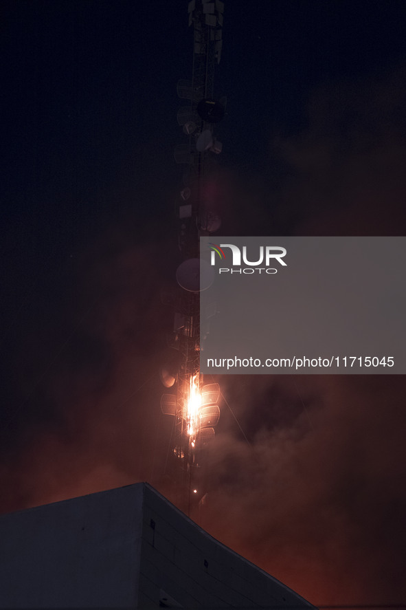 A telecommunication tower is on fire in downtown Tehran, Iran, on October 27, 2024. 