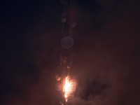 A telecommunication tower is on fire in downtown Tehran, Iran, on October 27, 2024. (