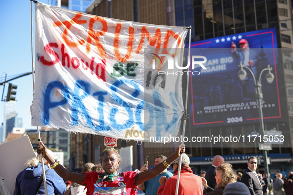 Nadine Seiler holds a sign protesting Donald Trump outside of Madison Square Garden in New York, New York on October 27, 2024 as the former...