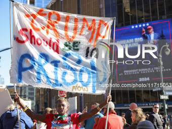 Nadine Seiler holds a sign protesting Donald Trump outside of Madison Square Garden in New York, New York on October 27, 2024 as the former...