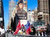 Supporters of Donald Trump carry flags outside of Madison Square Garden in New York, New York on October 27, 2024 as the former President ho...