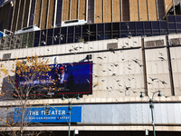 Pigeons fly past a sign outside of Madison Square Garden in New York, New York on October 27, 2024 as former President Donald Trump holds  a...