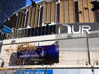 Pigeons fly past a sign outside of Madison Square Garden in New York, New York on October 27, 2024 as former President Donald Trump holds  a...