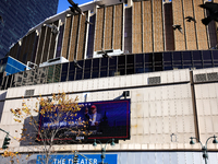 Pigeons fly past a sign outside of Madison Square Garden in New York, New York on October 27, 2024 as former President Donald Trump holds  a...