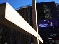 A Donald Trump supporter holds a cross outside of Madison Square Garden in New York, New York on October 27, 2024 as former President Donald...