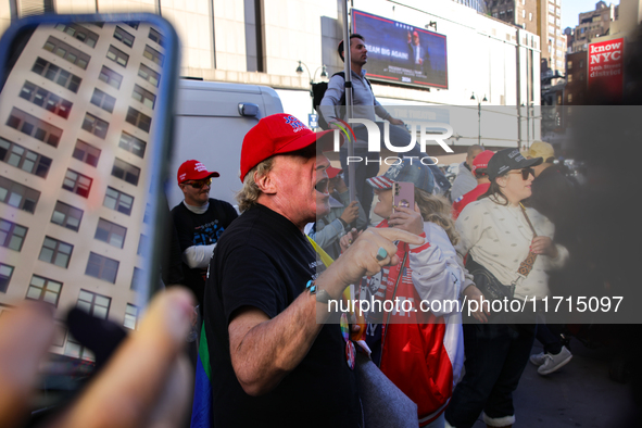 A supporter of Donald Trump argues with anti-Trump demonstrators outside of Madison Square Garden in New York, New York on October 27, 2024...