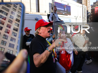 A supporter of Donald Trump argues with anti-Trump demonstrators outside of Madison Square Garden in New York, New York on October 27, 2024...