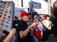 A supporter of Donald Trump argues with anti-Trump demonstrators outside of Madison Square Garden in New York, New York on October 27, 2024...