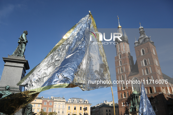 Participants in a protest against the suspension of asylum law under the slogan 'Fuck your borders' gather at the Main Square in Krakow, Pol...