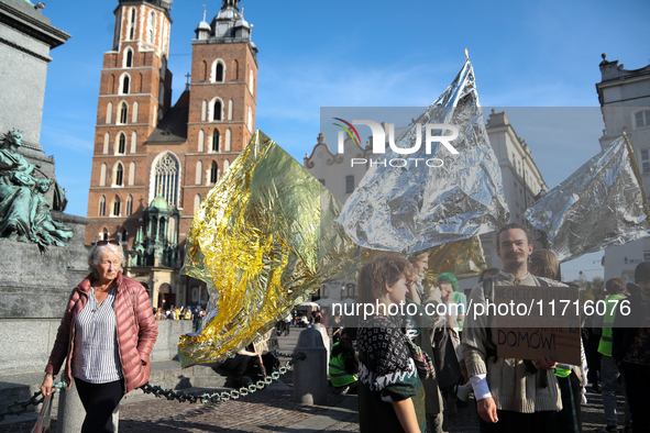 Participants in a protest against the suspension of asylum law under the slogan 'Fuck your borders' gather at the Main Square in Krakow, Pol...