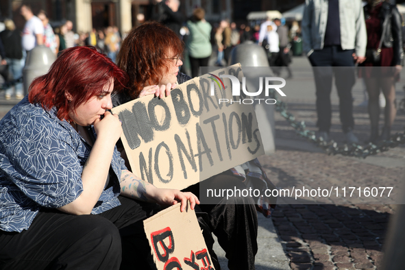 Participants in a protest against the suspension of asylum law under the slogan 'Fuck your borders' gather at the Main Square in Krakow, Pol...