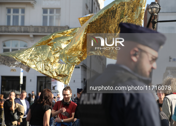 Participants in a protest against the suspension of asylum law under the slogan 'Fuck your borders' gather at the Main Square in Krakow, Pol...