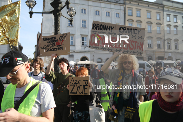 Participants in a protest against the suspension of asylum law under the slogan 'Fuck your borders' gather at the Main Square in Krakow, Pol...