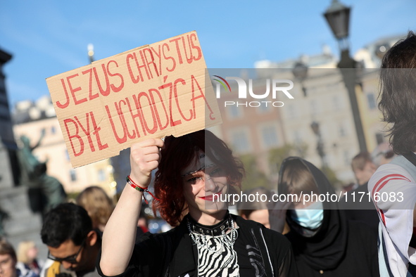 Participants in a protest against the suspension of asylum law under the slogan 'Fuck your borders' gather at the Main Square in Krakow, Pol...