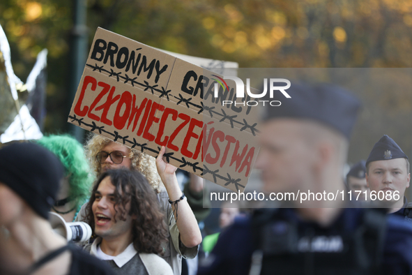 Participants of the protest against the suspension of asylum law under the slogan 'Fuck your borders' walk through the streets of the city i...