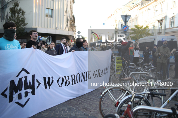 A counter-demonstration organized by the All-Polish Youth takes place during the protest against the suspension of asylum law under the slog...