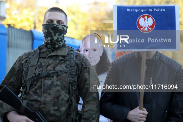 Participants of the counter-demonstration organized by the All-Polish Youth dress up Putin's face during a protest against the suspension of...