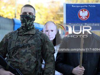 Participants of the counter-demonstration organized by the All-Polish Youth dress up Putin's face during a protest against the suspension of...