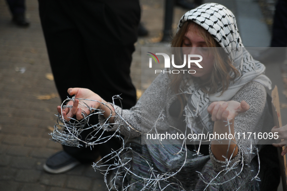 Participants protest against the suspension of asylum law under the slogan 'Fuck your borders' outside the Civic Platform office in Krakow,...