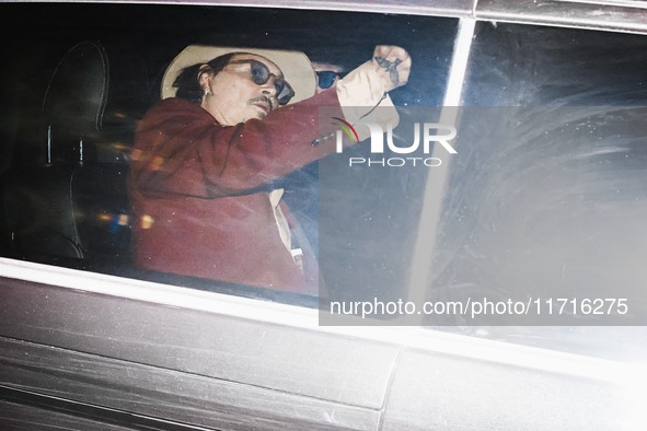 Johnny Depp leaves his hotel by car in Milan, Italy, on October 27, 2024 