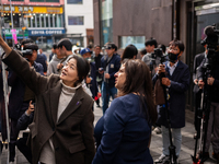 Artist Kwon Eun-bi introduces her work to Joanne Rached, the mother of foreign victim Grace Rached, at the opening ceremony of the new 10.29...