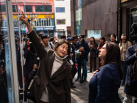 Artist Kwon Eun-bi introduces her work to Joanne Rached, the mother of foreign victim Grace Rached, at the opening ceremony of the new 10.29...