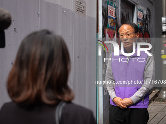 A representative speaks to the media during an interview at the site of the 10.29 Path of Remembrance and Safety in the Itaewon tragedy alle...