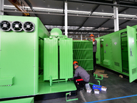 Workers produce power transmission equipment products at a workshop in Hai'an, Jiangsu province, China, on October 28, 2024. (