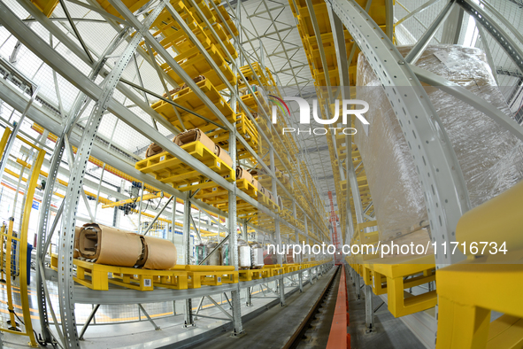 Workers produce power transmission equipment products at a workshop in Hai'an, Jiangsu province, China, on October 28, 2024. 