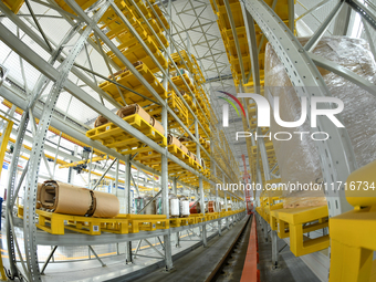 Workers produce power transmission equipment products at a workshop in Hai'an, Jiangsu province, China, on October 28, 2024. (