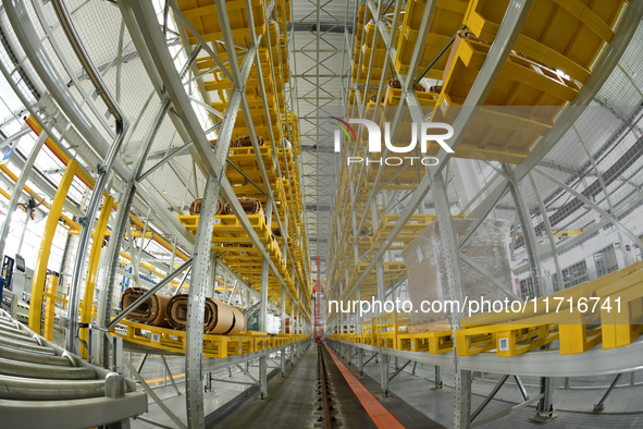 Workers produce power transmission equipment products at a workshop in Hai'an, Jiangsu province, China, on October 28, 2024. 