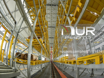 Workers produce power transmission equipment products at a workshop in Hai'an, Jiangsu province, China, on October 28, 2024. (