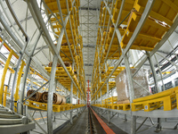 Workers produce power transmission equipment products at a workshop in Hai'an, Jiangsu province, China, on October 28, 2024. (