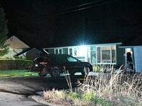 Police maintain a presence outside a home following the death of three people inside a home in Huntsville, Canada, on October 28, 2024. Earl...