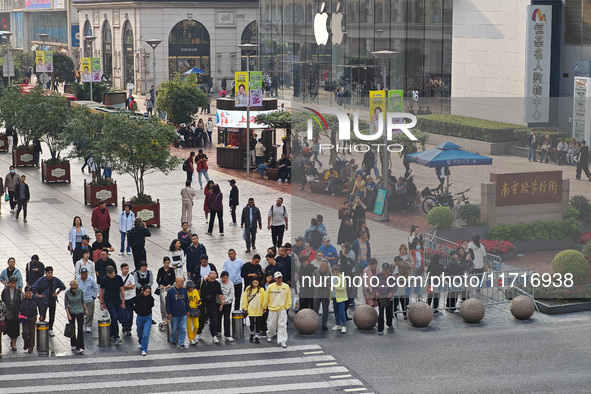 Chinese and foreign tourists bustle along the Nanjing Road Pedestrian Street in Shanghai, China, on October 28, 2024. 