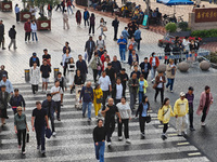 Chinese and foreign tourists bustle along the Nanjing Road Pedestrian Street in Shanghai, China, on October 28, 2024. (