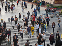 Chinese and foreign tourists bustle along the Nanjing Road Pedestrian Street in Shanghai, China, on October 28, 2024. (