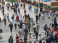 Chinese and foreign tourists bustle along the Nanjing Road Pedestrian Street in Shanghai, China, on October 28, 2024. (