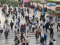 Chinese and foreign tourists bustle along the Nanjing Road Pedestrian Street in Shanghai, China, on October 28, 2024. (