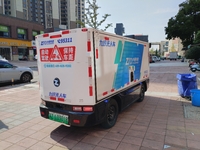 An unmanned delivery vehicle delivers packages for customers at a courier point in downtown Huai'an city, East China's Jiangsu province, on...