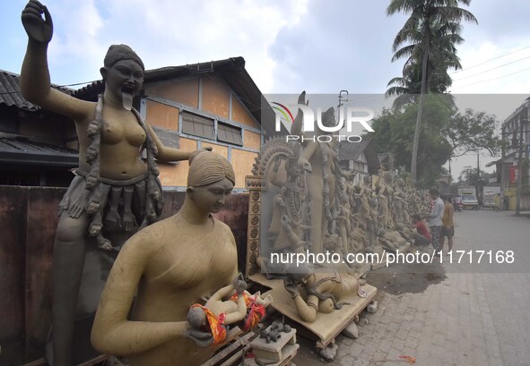 An artist works on an idol of the Hindu goddess Kali at a roadside workshop ahead of the Kali Puja festival in Nagaon District, Assam, India...