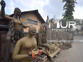 An artist works on an idol of the Hindu goddess Kali at a roadside workshop ahead of the Kali Puja festival in Nagaon District, Assam, India...