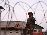 Indian soldiers stand alert while frisking vehicles and suspected persons in Baramulla, Jammu and Kashmir, India, on October 28, 2024. In th...