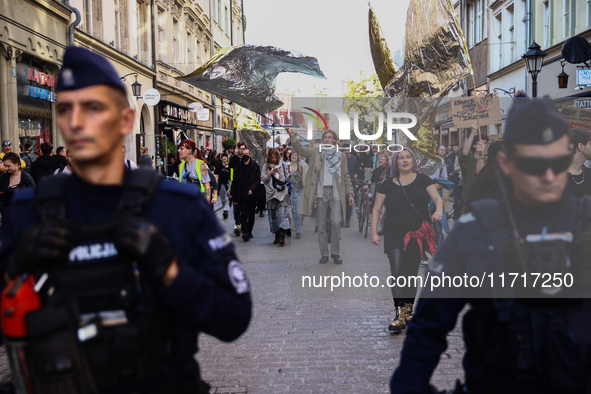 People attend a demonstration against the Polish government's plans to suspend the right to asylum for refugees illegally crossing the Polis...