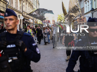 People attend a demonstration against the Polish government's plans to suspend the right to asylum for refugees illegally crossing the Polis...