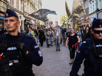 People attend a demonstration against the Polish government's plans to suspend the right to asylum for refugees illegally crossing the Polis...