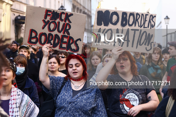 People attend a demonstration against the Polish government's plans to suspend the right to asylum for refugees illegally crossing the Polis...